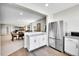 Open kitchen area featuring stainless steel appliances and white cabinets at 8661 S De Gaulle Ct, Aurora, CO 80016