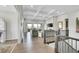 Spacious living room boasts a coffered ceiling and large windows to the outside at 8661 S De Gaulle Ct, Aurora, CO 80016