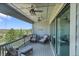 Covered patio with outdoor seating, ceiling fans, and beautiful views at 8661 S De Gaulle Ct, Aurora, CO 80016