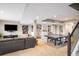 Finished basement with a comfortable seating area, built-in shelving, and a ping pong table for recreation at 14807 Haley Ave, Parker, CO 80134