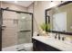 Modern bathroom with glass-enclosed shower, marble countertop vanity, and neutral decor at 14807 Haley Ave, Parker, CO 80134