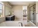 Bright bathroom features tub, shower, and double vanity with granite counters, with access to the main bedroom at 14807 Haley Ave, Parker, CO 80134