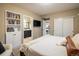 Main bedroom with ensuite bathroom, built-in bookcase, and generous closet space at 14807 Haley Ave, Parker, CO 80134