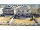 Aerial view of the home's backyard, complete with grass and a patio, in a neighborhood that features solar panels at 12759 Buffington Trl, Parker, CO 80134