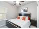 Bedroom with a queen-size bed, ceiling fan, and modern decor at 12759 Buffington Trl, Parker, CO 80134