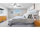 Bright bedroom with ceiling fan, plush carpet, and a neutral color palette, creating a serene and inviting space at 12759 Buffington Trl, Parker, CO 80134
