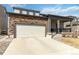 Attractive two-story home with a two-car garage and stone detailing on the exterior at 12759 Buffington Trl, Parker, CO 80134