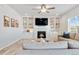 Inviting living room showcasing a fireplace, custom built-ins, and a neutral color palette at 12759 Buffington Trl, Parker, CO 80134