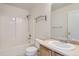 Bathroom features a vanity, toilet, and a shower over tub at 5522 S Quemoy Cir, Aurora, CO 80015