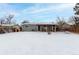 Backyard view of home with covered patio and dog house at 5332 Granby St, Denver, CO 80239