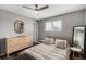 Bright bedroom with wood-look floors and a ceiling fan at 5332 Granby St, Denver, CO 80239