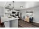 Modern kitchen with white cabinets, stainless steel appliances, and quartz countertops at 5332 Granby St, Denver, CO 80239