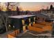 Townhome exterior with fenced yard and patio at dusk at 2890 S Sherman St, Englewood, CO 80113
