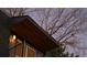 Close-up of a balcony and the angle of the roof line during dusk under a bare tree at 2890 S Sherman St, Englewood, CO 80113