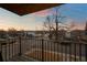 Scenic balcony view showcasing the neighborhood with colorful skies during dusk and charming houses at 2890 S Sherman St, Englewood, CO 80113