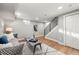 Basement living room featuring recessed lighting, hardwood floors, and a staircase at 2890 S Sherman St, Englewood, CO 80113