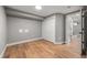 Empty basement featuring wood floors, a double closet, and a round ceiling light at 2890 S Sherman St, Englewood, CO 80113