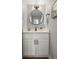 Stylish bathroom with modern vanity, round mirror, and contemporary fixtures at 2890 S Sherman St, Englewood, CO 80113