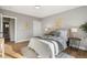 Peaceful bedroom featuring plush bedding, a calming color palette, and a relaxing atmosphere at 2890 S Sherman St, Englewood, CO 80113