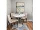 Cozy dining area with white table and seating for four at 2890 S Sherman St, Englewood, CO 80113