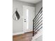 Bright entryway featuring a modern door with window and a stylish teardrop mirror at 2890 S Sherman St, Englewood, CO 80113