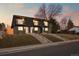 Contemporary townhome with striking black exterior, individual balconies, and well-maintained front lawns at 2890 S Sherman St, Englewood, CO 80113