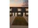 Three townhomes with striking black exteriors, individual balconies, and well-maintained front lawns at 2890 S Sherman St, Englewood, CO 80113