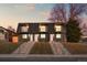 Charming exterior showcasing well-maintained duplex with symmetrical design and inviting staircases at 2890 S Sherman St, Englewood, CO 80113