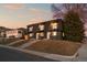 Contemporary townhome with striking black exterior, individual balconies, and well-maintained front lawns at 2890 S Sherman St, Englewood, CO 80113