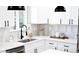 Bright and modern kitchen featuring white cabinetry, stainless steel appliances, and sleek black fixtures at 2890 S Sherman St, Englewood, CO 80113