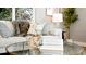 Living room with a glass coffee table, decorative vases, and a cozy sofa with pillows at 2890 S Sherman St, Englewood, CO 80113