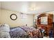 Basement bedroom with a comfortable bed and a dresser with an attached mirror at 6033 Hoyt Ct, Arvada, CO 80004