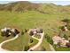 Stunning aerial view of the property, showcasing its acreage, landscaping, and home exteriors at 27 Tamarade Dr, Littleton, CO 80127