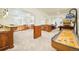 Expansive basement featuring carpet, wood trim, a shuffleboard, seating and a fireplace at 27 Tamarade Dr, Littleton, CO 80127