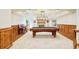 Spacious basement featuring carpet, wood trim, a pool table and a fireplace at 27 Tamarade Dr, Littleton, CO 80127