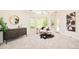 Bright main bedroom features a sitting area and a large dresser with decorative art at 27 Tamarade Dr, Littleton, CO 80127