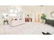 Spacious main bedroom features large windows, a seating area, and a decorative bar area at 27 Tamarade Dr, Littleton, CO 80127