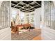 Charming office space with a stylish black coffered ceiling, ample natural light, and unique architectural details at 27 Tamarade Dr, Littleton, CO 80127