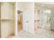 Spacious walk-in closet with built-in shelving and mirrored dressing area at 27 Tamarade Dr, Littleton, CO 80127