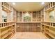 Beautiful wine cellar with custom racking and stone floors, ready for the wine enthusiast at 27 Tamarade Dr, Littleton, CO 80127