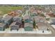 Community aerial view showing townhomes with solar panels, garages, and street parking at 847 Great Plains Ave, Berthoud, CO 80513
