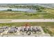 Aerial view of a modern townhome community near a lake, perfect for tranquil living at 847 Great Plains Ave, Berthoud, CO 80513
