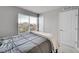 Comfortable bedroom featuring plush carpeting and natural light at 847 Great Plains Ave, Berthoud, CO 80513