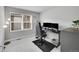 Bedroom featuring a sleek black gaming setup, comfortable desk chair, and minimalist decor at 847 Great Plains Ave, Berthoud, CO 80513