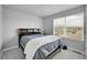 Bedroom featuring plush carpeting, neutral walls, and natural light at 847 Great Plains Ave, Berthoud, CO 80513