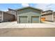 Two car garage with a large cement driveway provides parking and storage at 847 Great Plains Ave, Berthoud, CO 80513