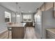 A spacious kitchen with modern appliances, a large island, and ample natural light, ideal for culinary enthusiasts at 847 Great Plains Ave, Berthoud, CO 80513