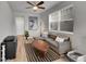 Cozy living room with modern decor, a comfortable sofa, and ample natural light, creating a welcoming atmosphere at 847 Great Plains Ave, Berthoud, CO 80513