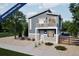Charming two-story home featuring gray siding, a quaint balcony, and a well-maintained stone yard at 46558 Avery Ln, Bennett, CO 80102