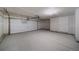 Spacious garage with a large door and ample room for vehicles and storage, offering practicality at 46558 Avery Ln, Bennett, CO 80102